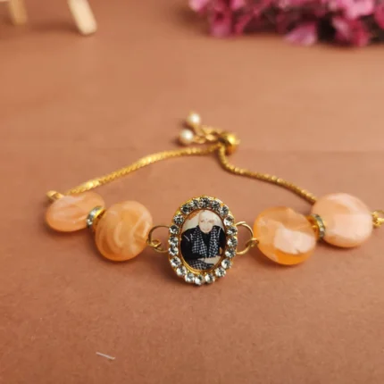 Peach Round Pearl Bracelet with Jai Guruji Swaroop Handmade Bracelets
