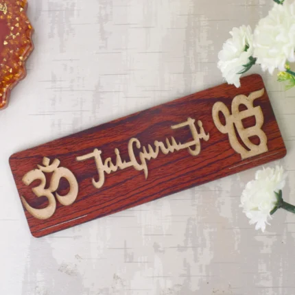 Om Jai Guruji Written on Brown MDF Sheet Door Plate